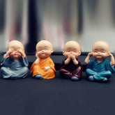 Set of 4 Miniature Decorative Buddha Monk Figurines Showpiece for Dashboard Car Interior Decoration (Multicolor)